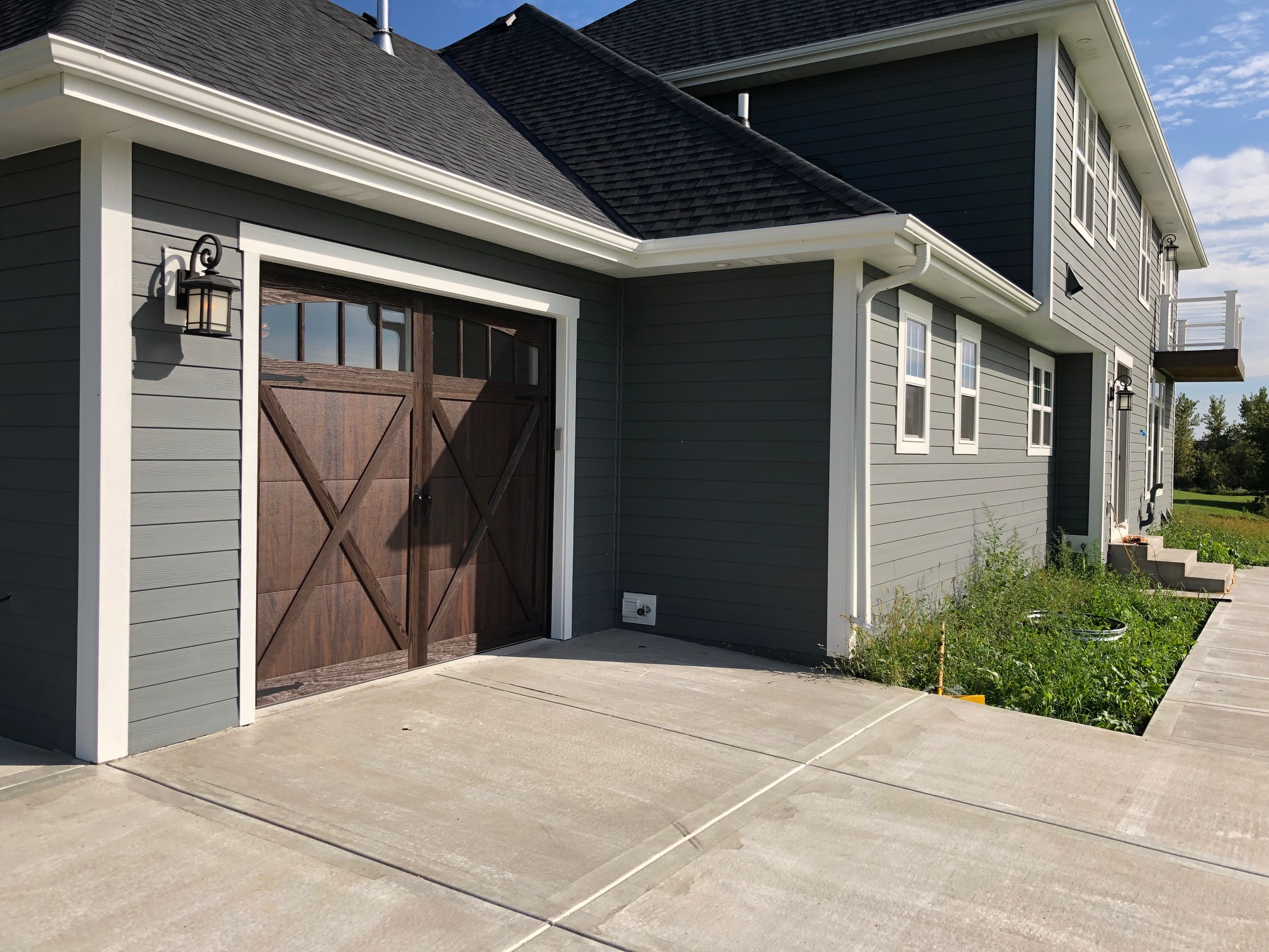 Walnut carriage style garage door installation in Bend Oregon