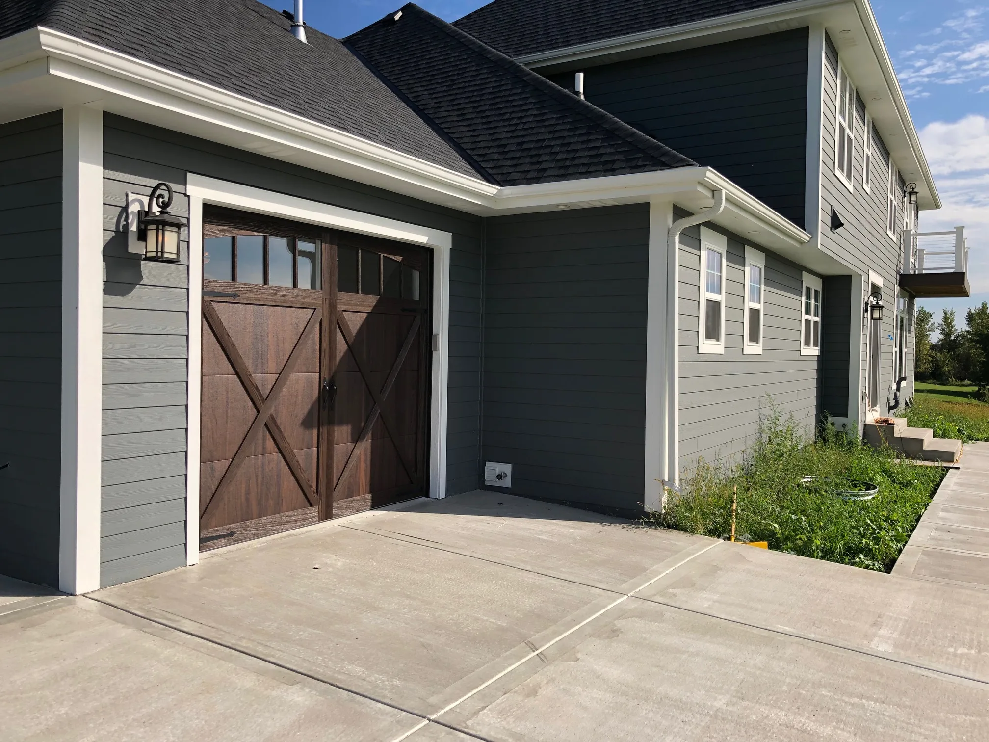 Walnut carriage style garage door installation in Bend Oregon