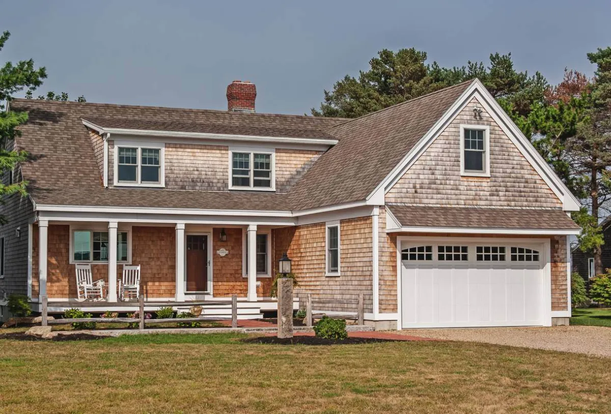 White overlay carriage house door — similar to styles approved in Eagle Crest